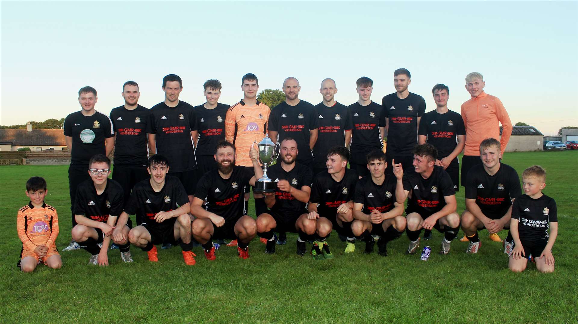 Lybster players with the Caithness AFA Division Two trophy after sealing the title with Monday's 5-0 win at Watten. Picture: Alan Hendry