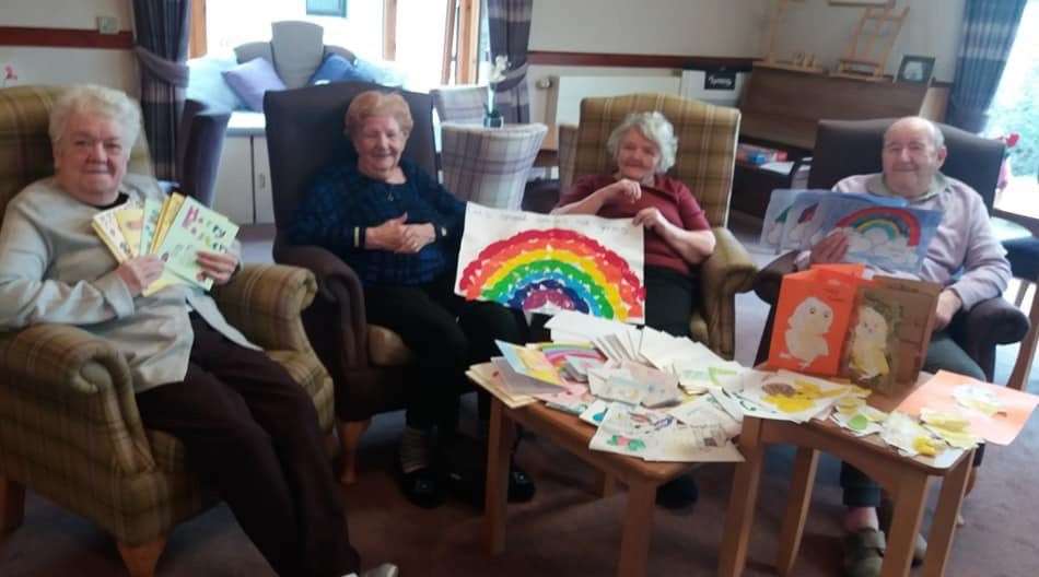 Some of the residents at Seaview House with cards, letters and pictures they have received.