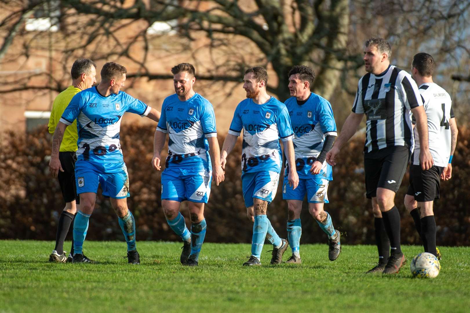 Loch Ness players celebrate Ryan Ingram's goal in the leaders' 3-2 win against Alness United.