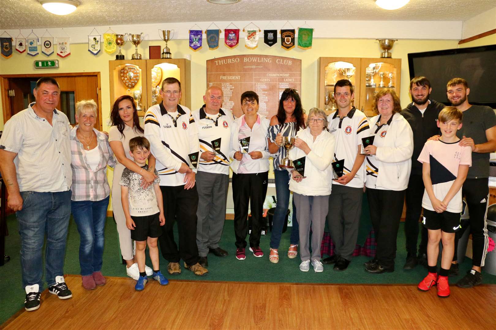 Winners and family members after the Ivy Macleod Memorial Open Triples at Thurso Bowling Club.