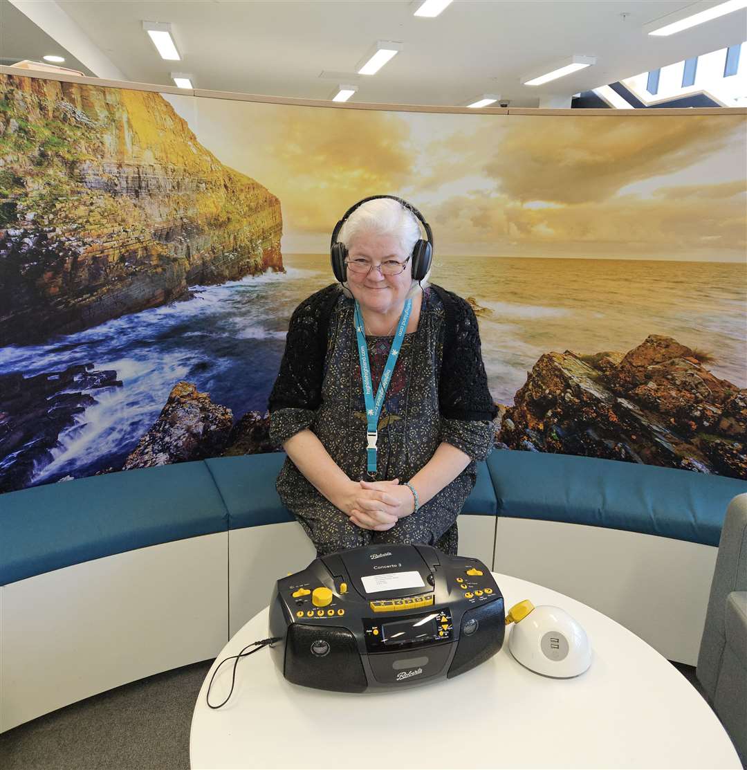 Librarian Ruan Peat with the new tape player at Wick Library.
