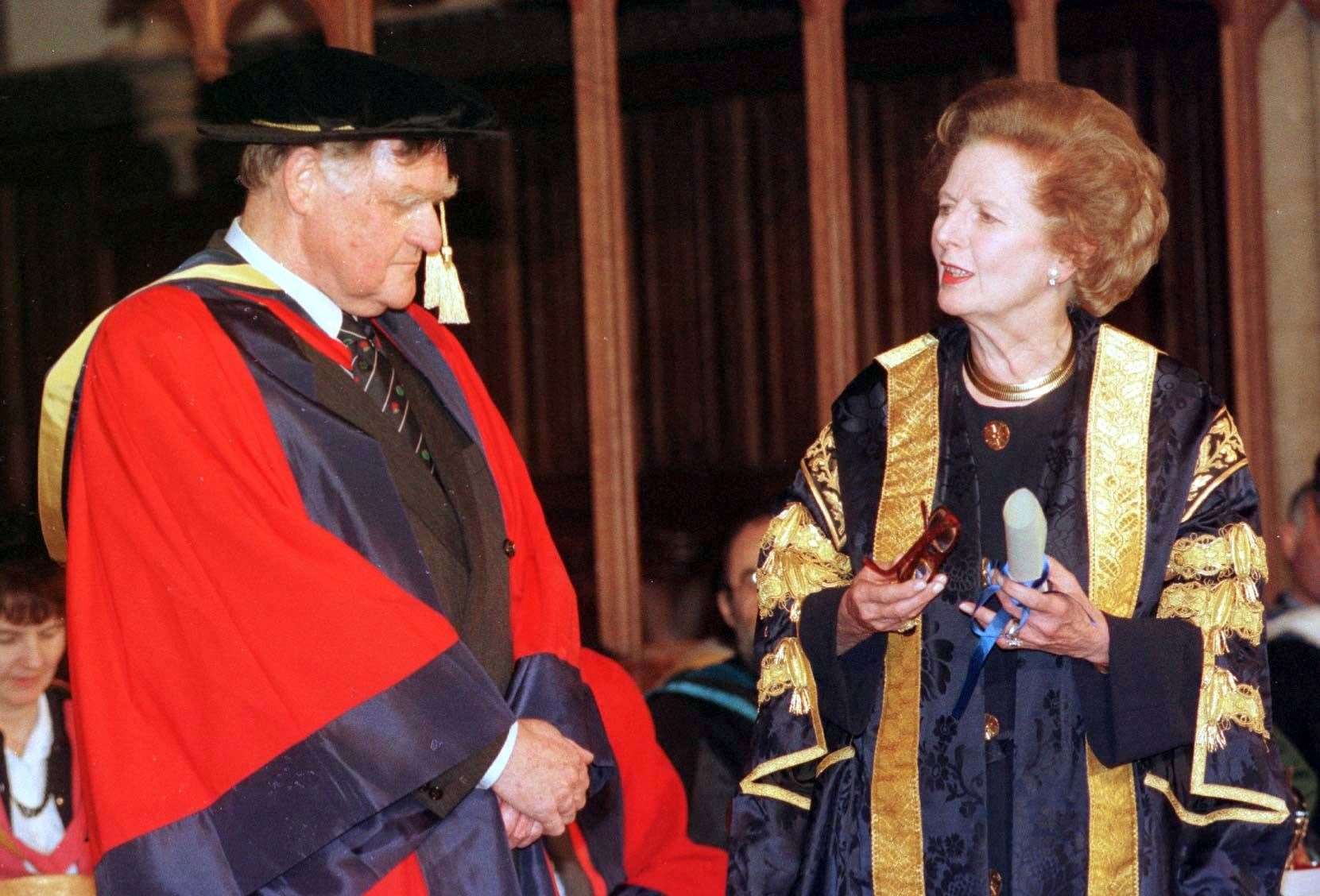 Baroness Thatcher confers an honorary degree on her former press secretary, Sir Bernard Ingham (Tim Ockenden/PA)