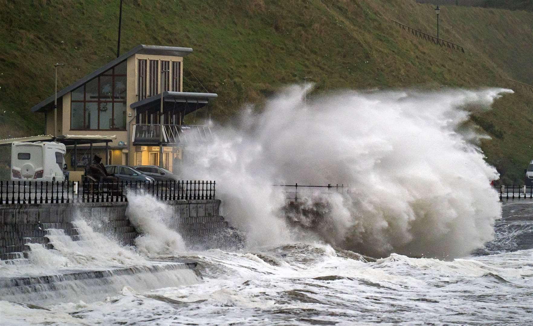 Waves crash over the promenade in Scarborough (Danny Lawson/PA)