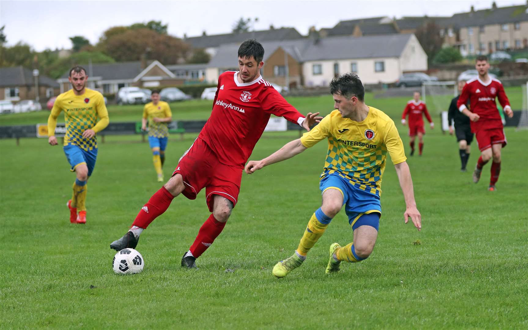 Thurso's Connor MacIntosh tries to get past Steven Hellewell of Orkney in Saturday's North Caledonian League match which the islanders won comfortably. Picture: James Gunn