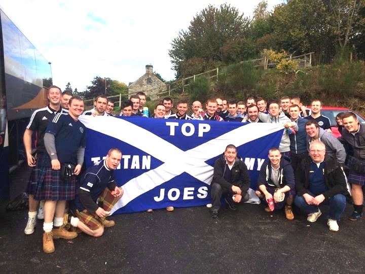 Members of Top Joes Tartan Army on a previous trip to support the national team.