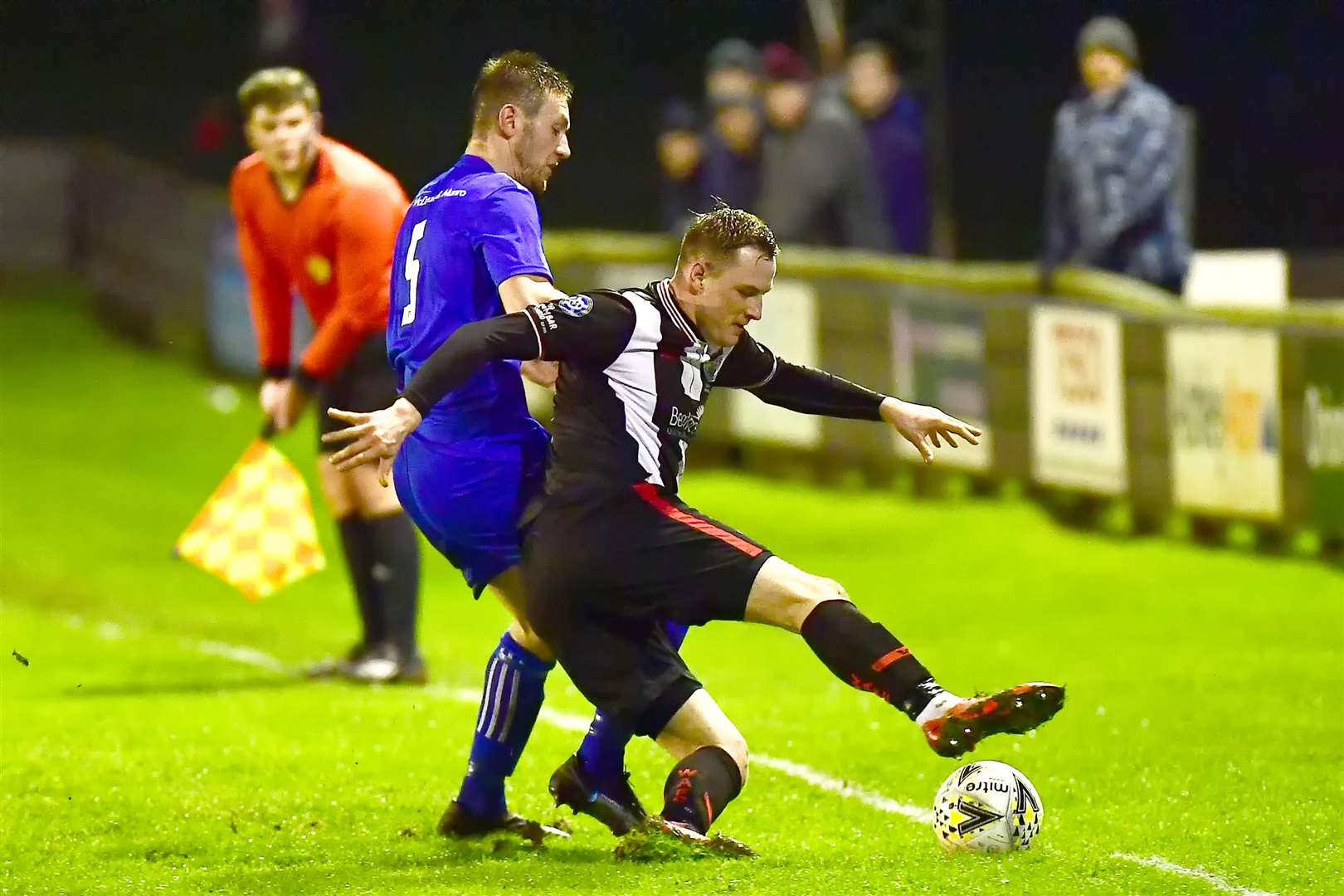 Wick striker Steven Anderson controls the ball with Lossie's Dean Stewart in close attendance. Picture: Mel Roger