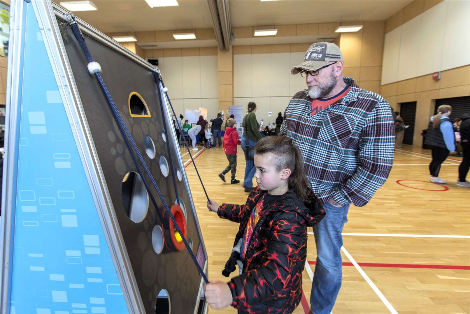 Ivan Stronach from Dunbeath tests his manual dexterity. Photo: Robert MacDonald/Northern Studios