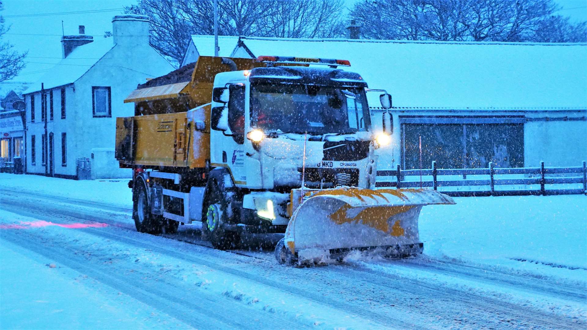 A Highland Council gritter makes its way through Watten during last winter. Picture: DGS