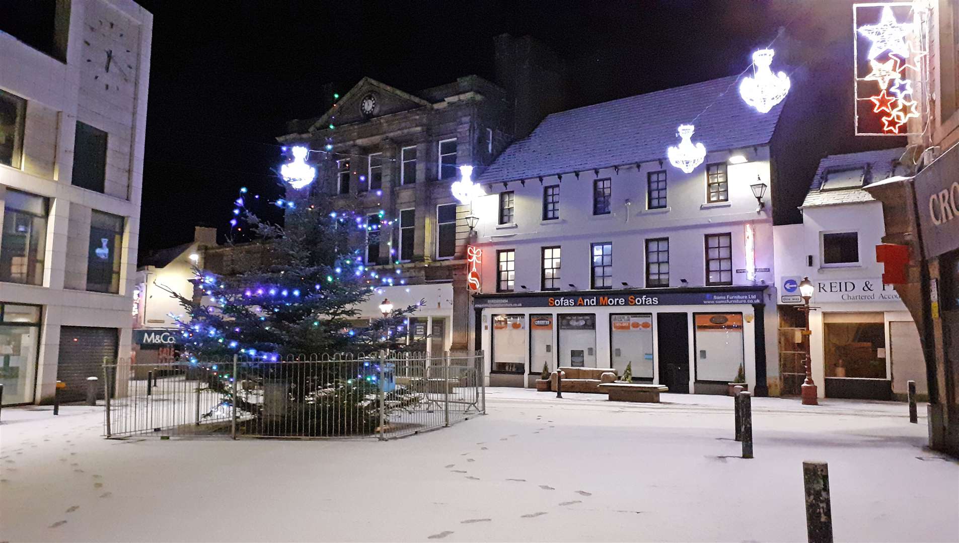 Wick town centre's Christmas tree in late January this year. The tree and lights have had to remain in place for a prolonged period.