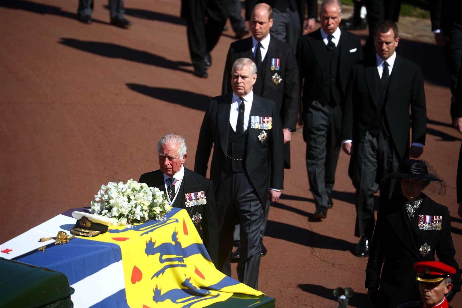 Senior royals walk behind the Duke of Edinburgh’s coffin (Hannah McKay/PA)