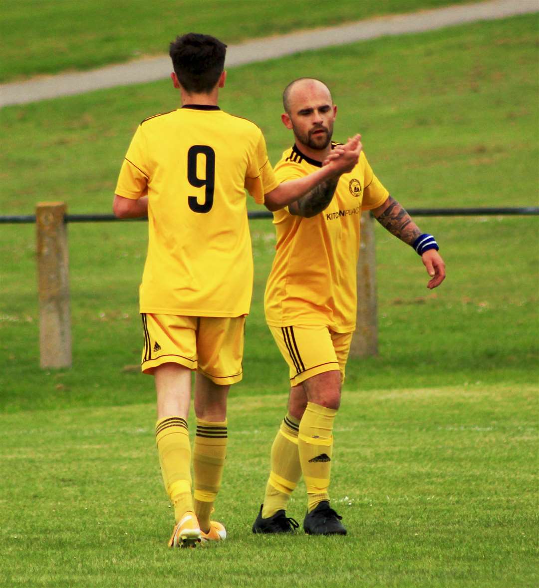 Matthew Aitkenhead (left) and Martin Banks celebrate one of Staxigoe United's 17 goals against Top Joe's on Tuesday night.