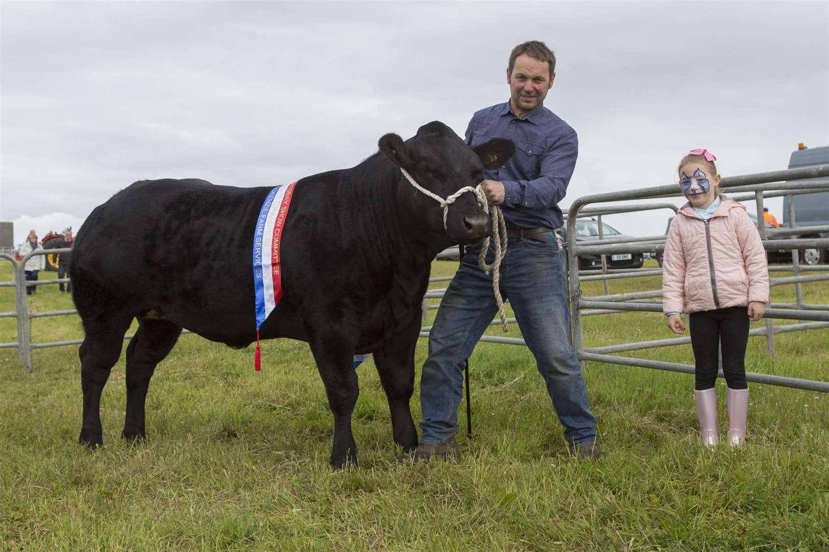 Champion of champions at the 2019 Canisbay Show went to the supreme cattle winner Double or Quits, an 18-month-old British Blue heifer, owned by Gordon Begg. Also in the picture is Gordon's daughter Morven. Picture: Robert MacDonald / Northern Studios