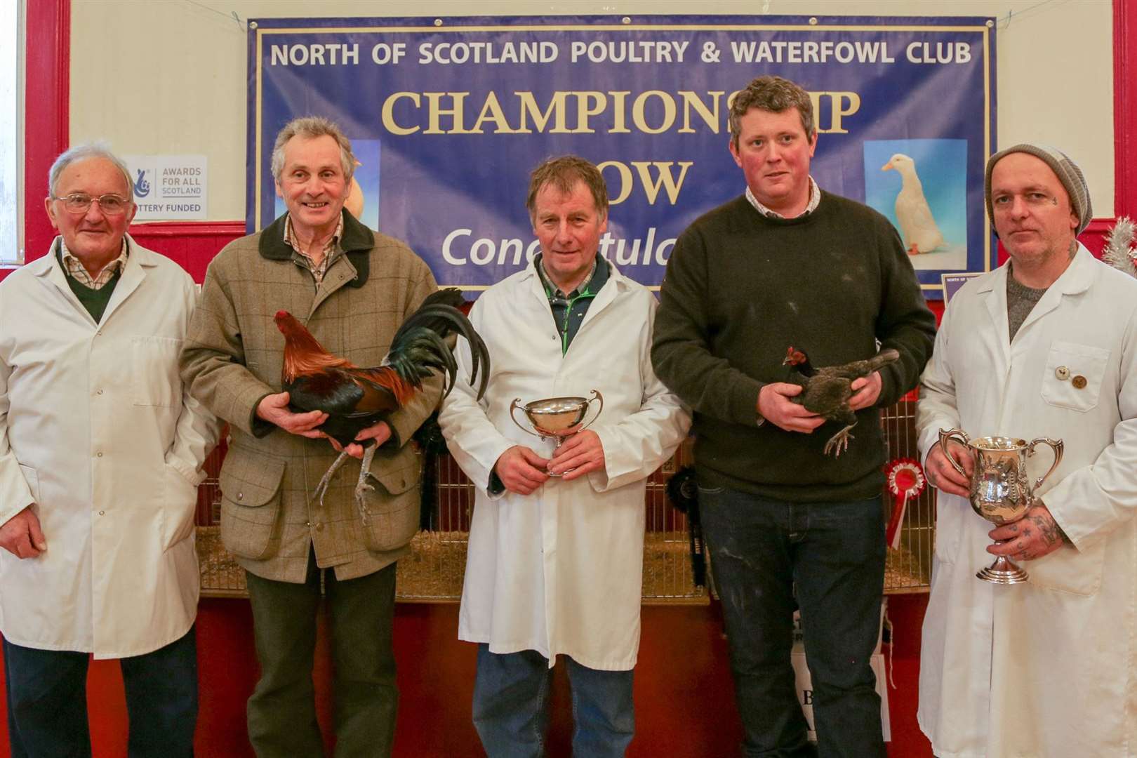 From left: Judge Don Manson, Robbie Parkin holding the reserve champion, judge Duncan Firth, Callum Gibson holding the best in show and judge Donald Bruce. Picture: Khush Celli