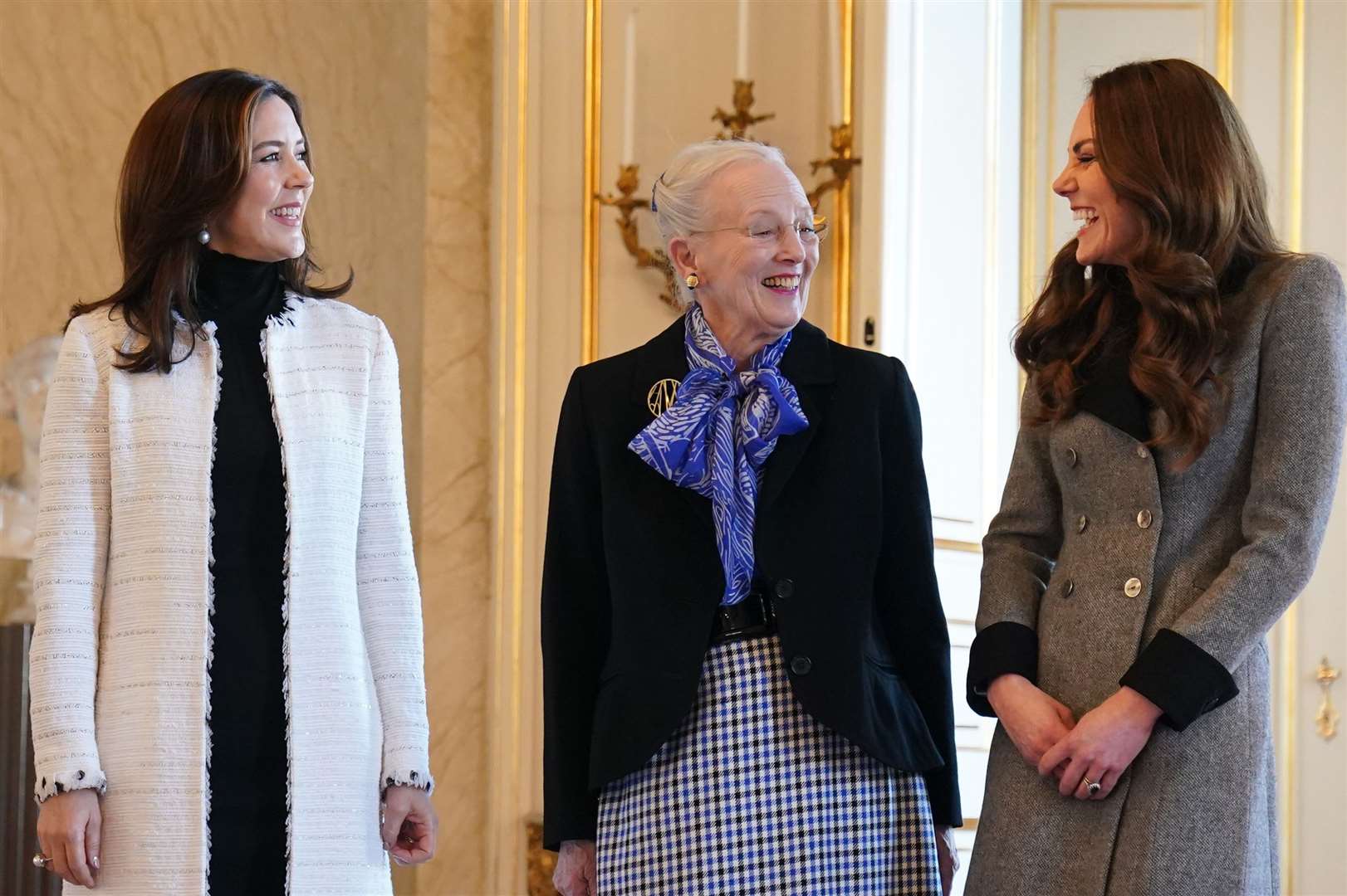 The then Duchess of Cambridge is welcomed by Queen Margrethe II (centre) and Crown Princess Mary of Denmark during a visit in 2022 (Owen Humphreys/PA)