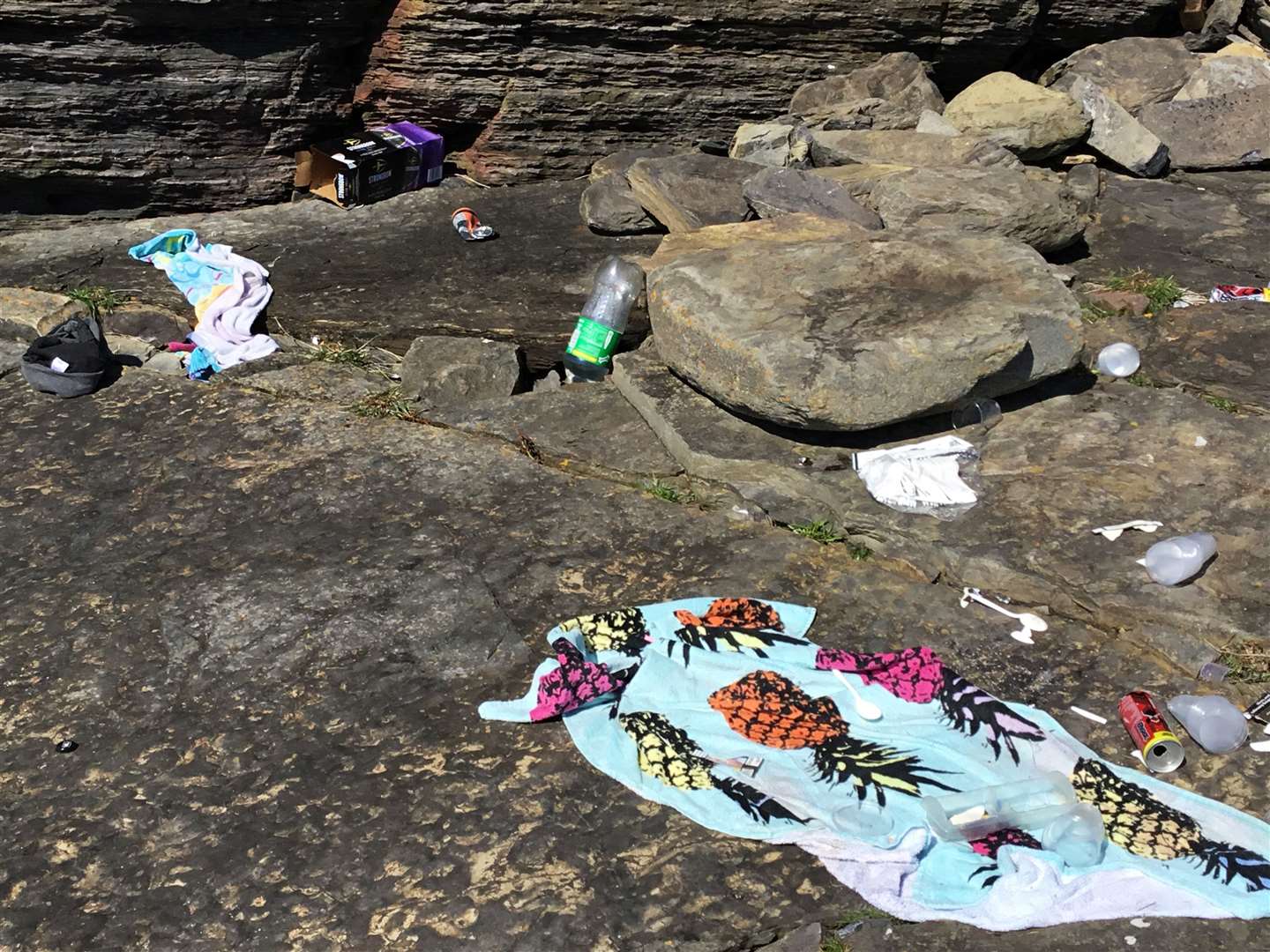 This beach towel was among the many items tidied up by Mary and Alister Richard on Sunday. They filled three bin bags with rubbish left behind after what had evidently been a drink-fuelled gathering.
