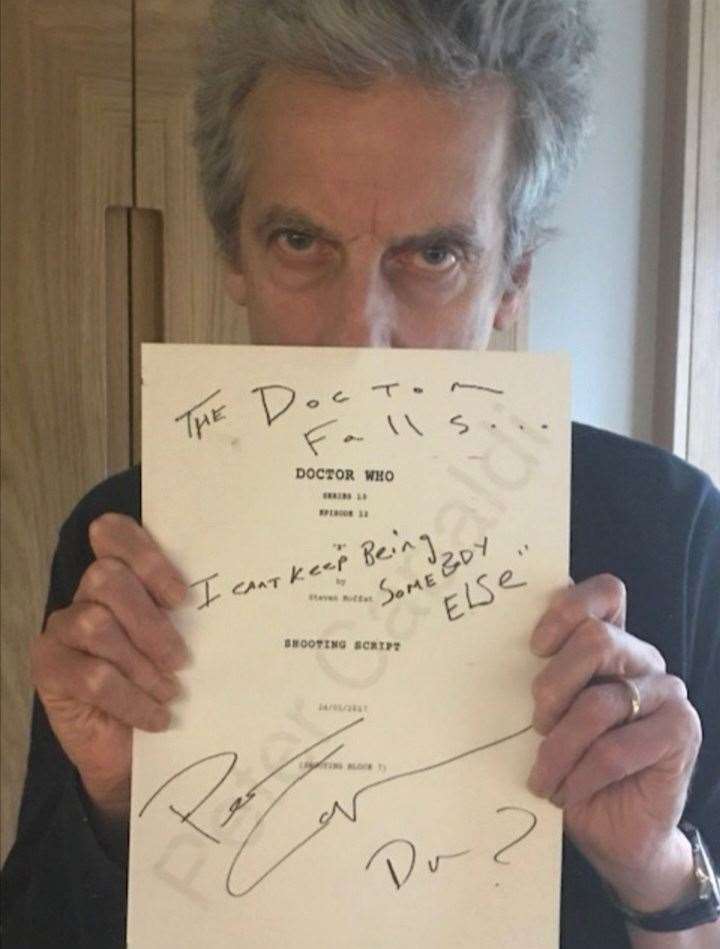 Peter Capaldi with his signed script for the episode The Doctor Falls (CHAS/PA)