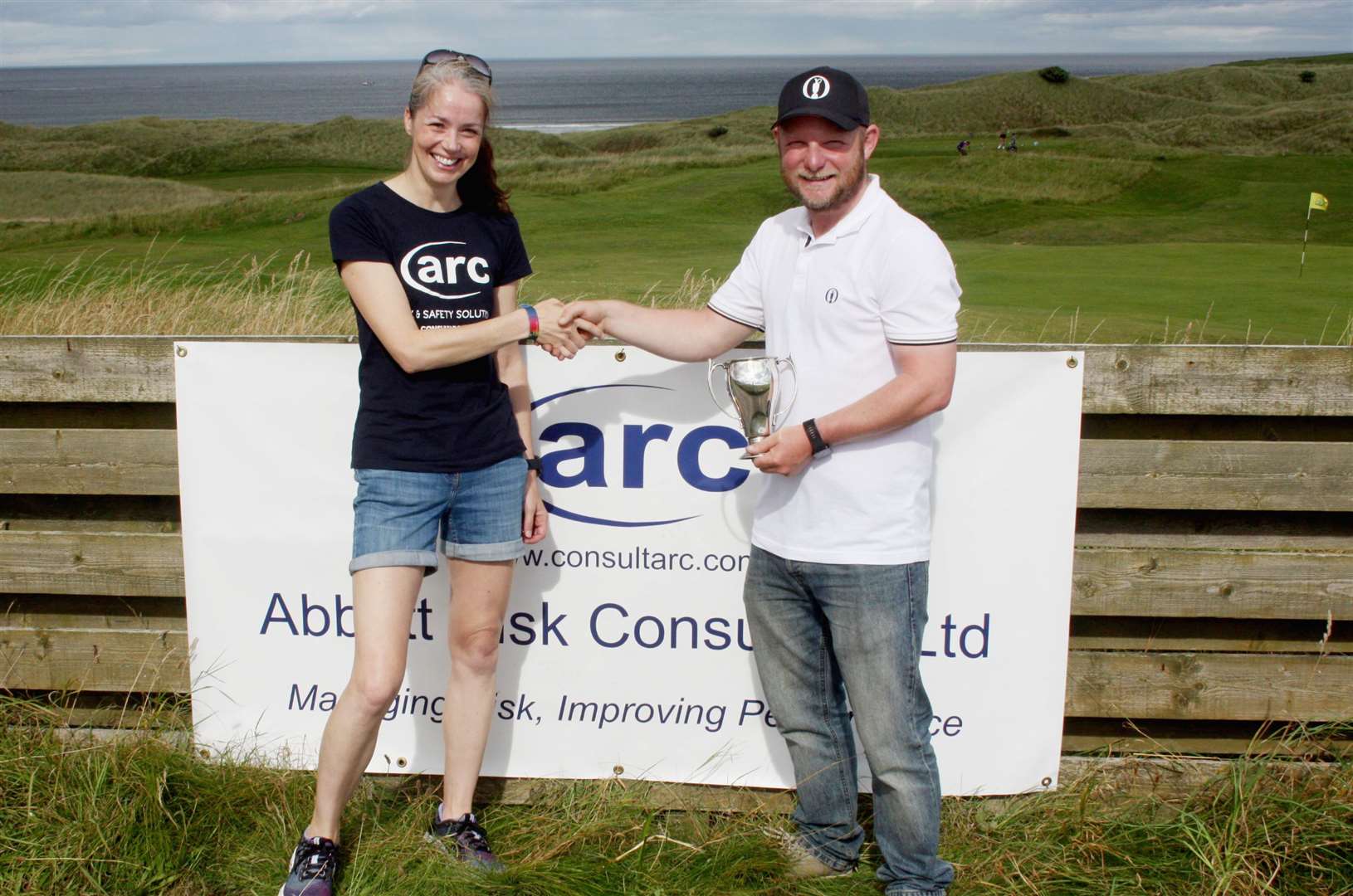 Marianne Wilson of Abbott Risk Consulting presenting the Summer Stableford trophy to winner Jason Norwood.
