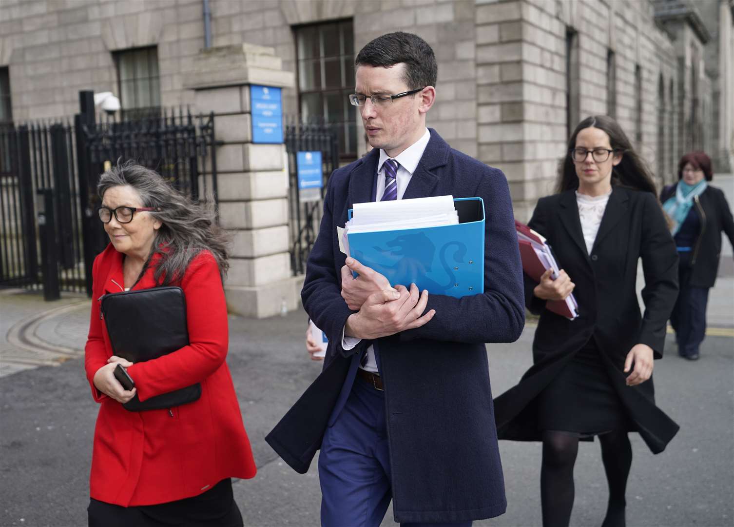 Enoch Burke with his mother Martina and sister Ammi leaving the High Court in Dublin (Niall Carson/PA)