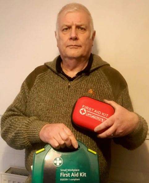 Steve Gibson holding some of the medical supplies that have been donated.