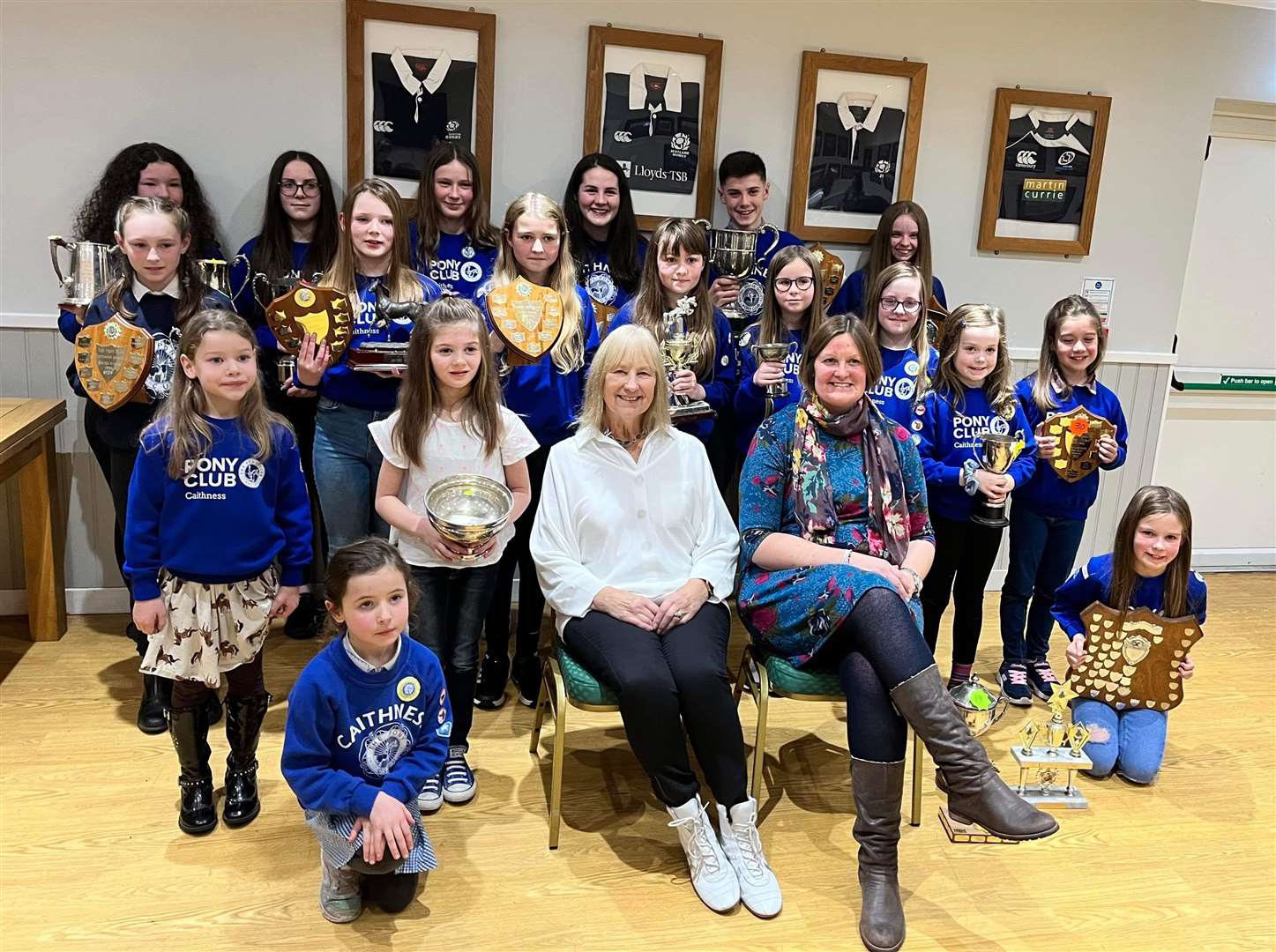 Members of the Caithness branch of the Pony Club along with retiring committee member Pauline Coghill (seated, front left) and district commissioner Debbie Pottinger.