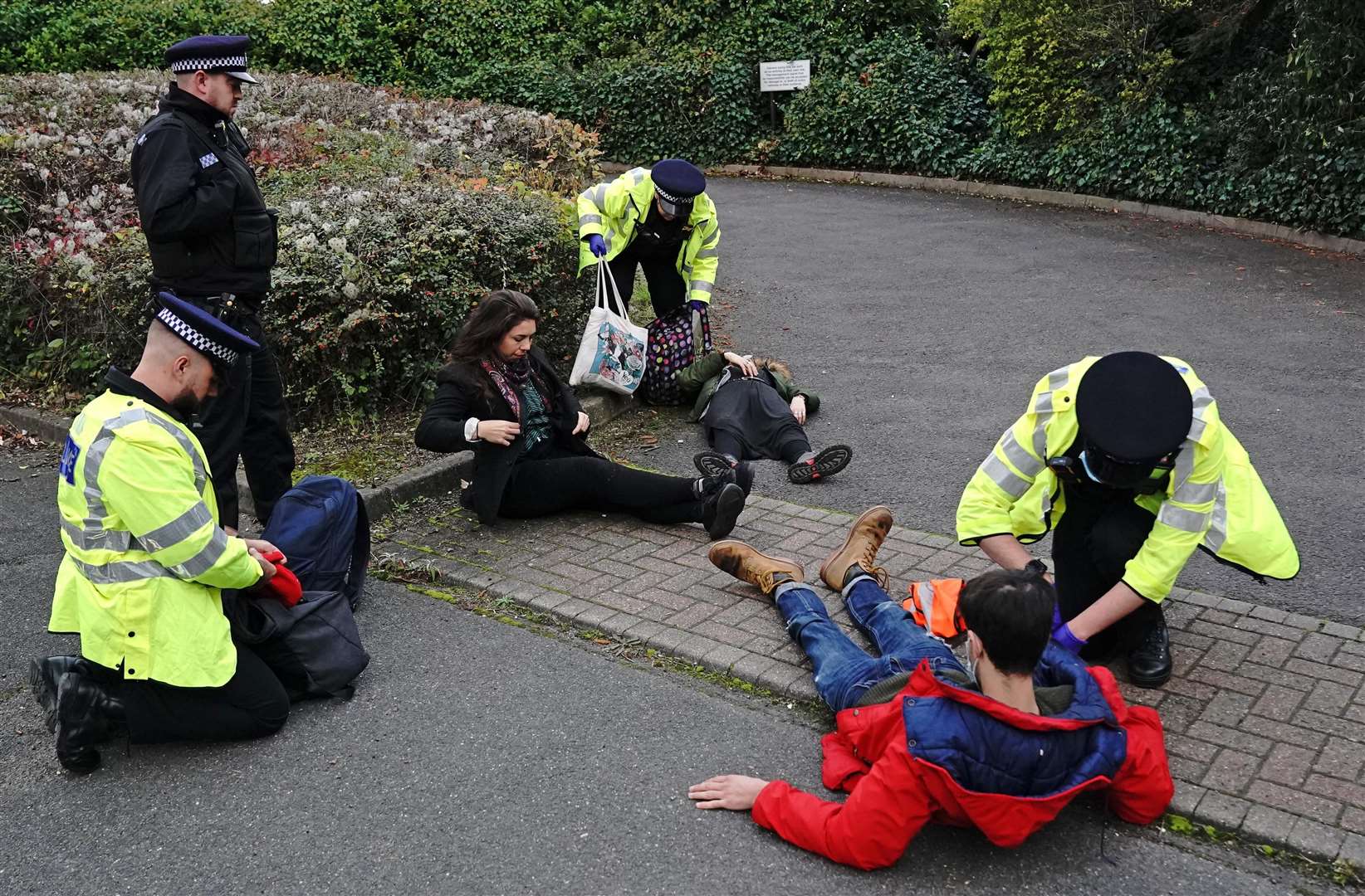 Protesters from Insulate Britain are arrested by police in the car park of the DoubleTree Hilton at Dartford Crossing (Jonathan Brady/PA)