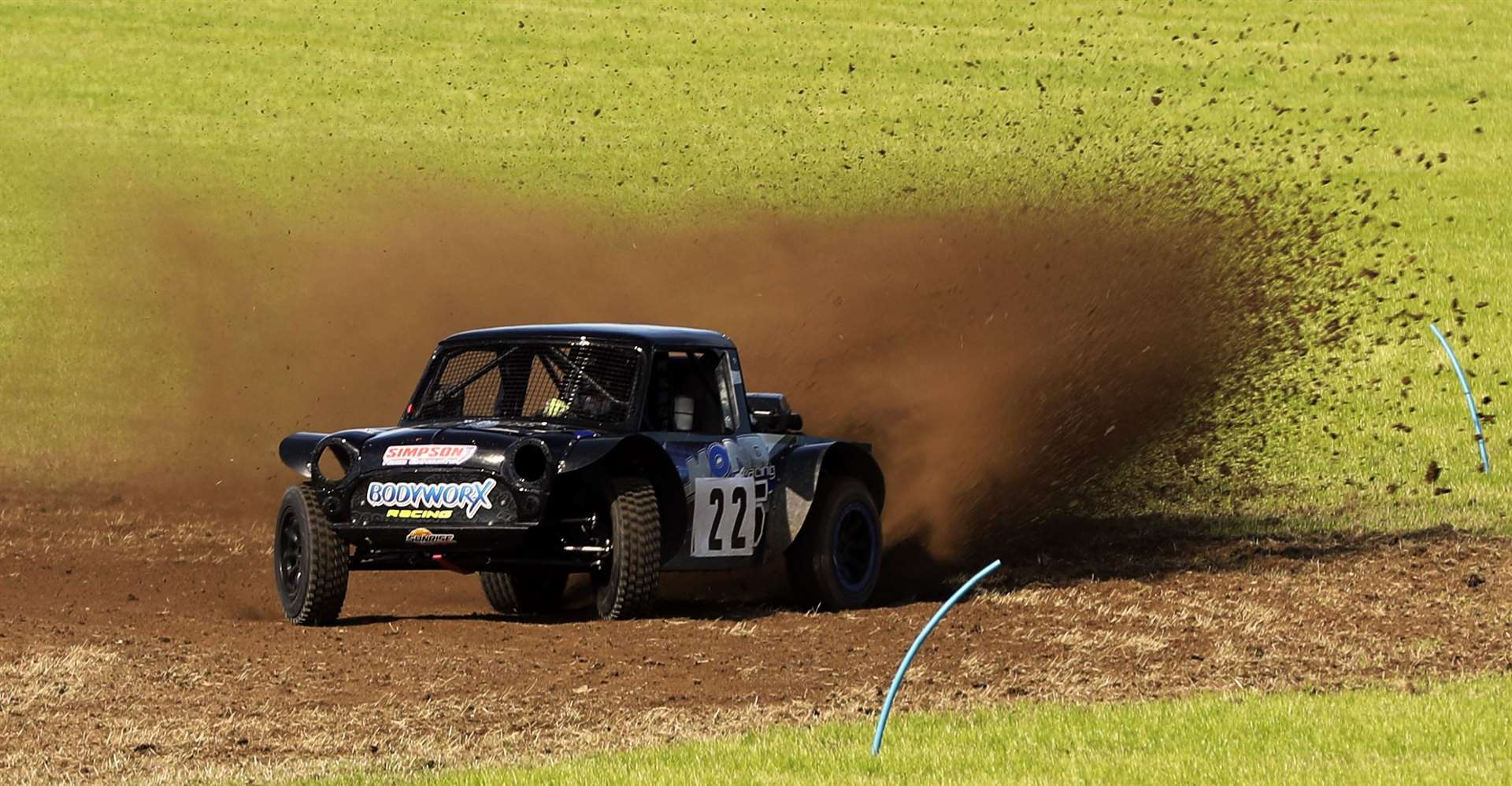 Gary Elder in his special twin-engined Mini takes a corner broadside on his way to the fastest time of the day. Picture: James Gunn