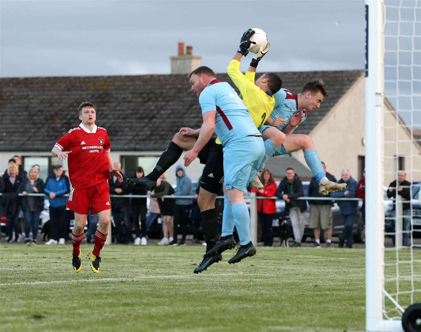 Graeme Williamson of Wick Groats saves under pressure from Pentland United pair James Murray and Cameron Montgomery. Picture: James Gunn
