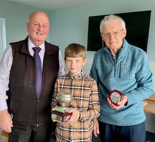 Kayden Malcolm after being presented with the Caithness para sportsperson of the year award, the Lady Thurso Rosebowl, by outgoing Caithness Sports Council chairman Bill Robertson (right) and executive committee member Willie Mackay