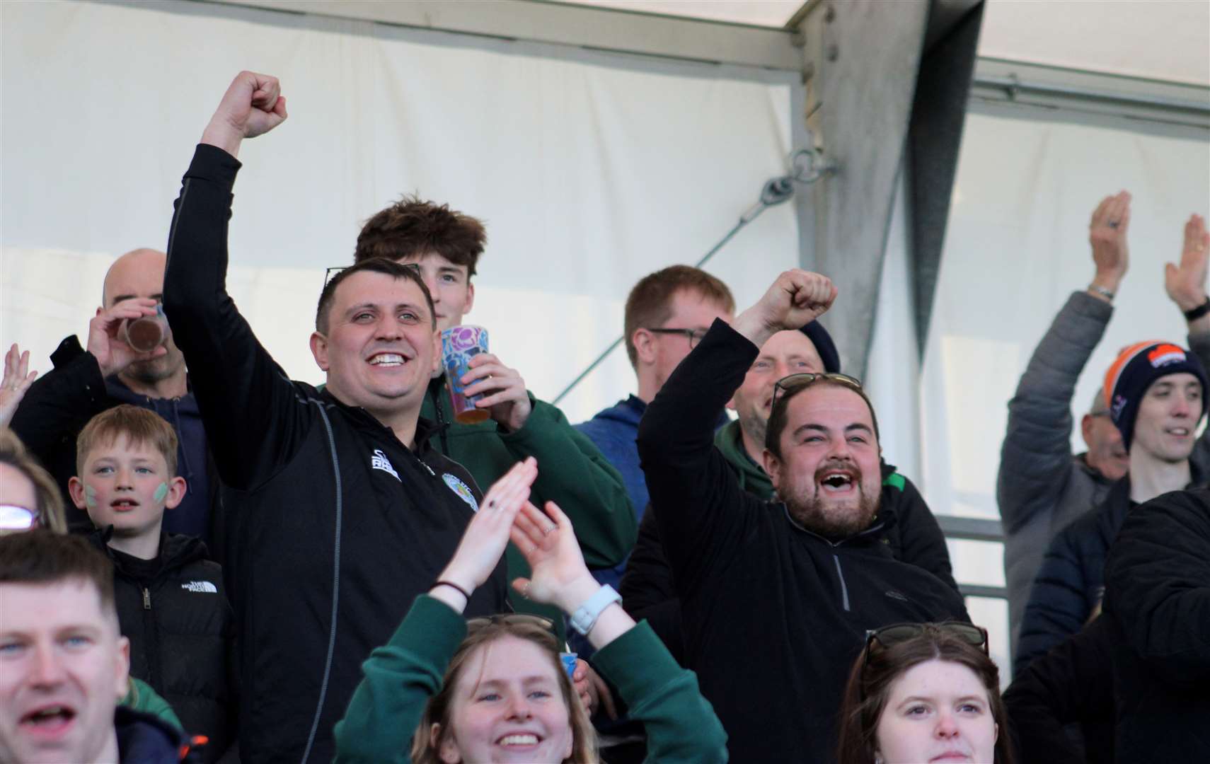 Some of the Caithness supporters cheering on the team. Picture: Anja Johnston