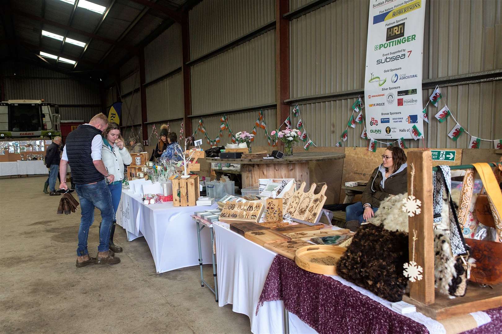 The only way to get away from the weather and the mud was to visit the local craft stalls, in one of the farm buildings. Photo: Robert MacDonald/Northern Studios