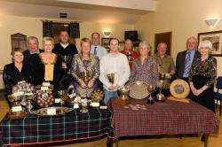 Some of Wick Golf Club's trophy winners pose for a photograph following their awards presentation in the clubhouse. the men's champion is Nicky Kilimas and the ladies' champion is Marion Mackay, both centre front.