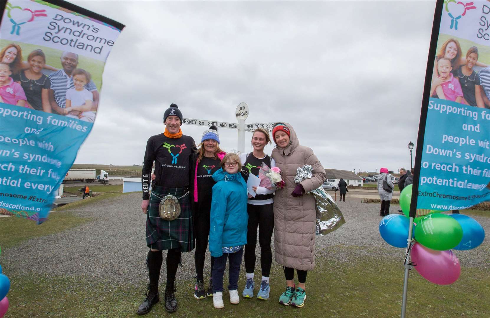 Iris Hammond and her sister Nancy with three of the runners who ran some of the Highland legs - Kevin Cummings, a financial and business analist with the Down's Syndrome Scotland Charity, Eilidh Scott, (right), who ran from Alness to Dornoch and Lorna Stanger, Thurso, who completed the penultimate leg from Helmsdale to Wick. Picture: Robert MacDonald/Northern Studios