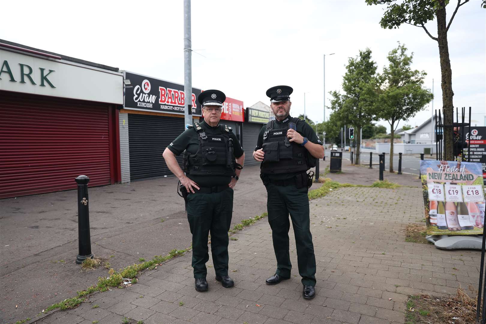 Police Service of Northern Ireland Chief Constable Simon Byrne (left) on a walkabout with an unnamed officer in Ardoyne, Belfast (Liam McBurney/PA)
