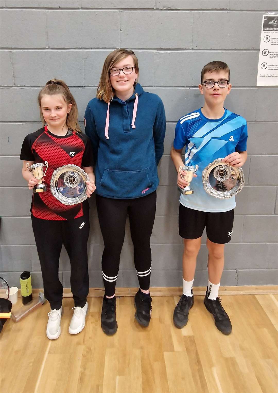 Mixed doubles winners Ava Cook and Matthew Cook with Chloe Mackenzie of Highland Workwear.