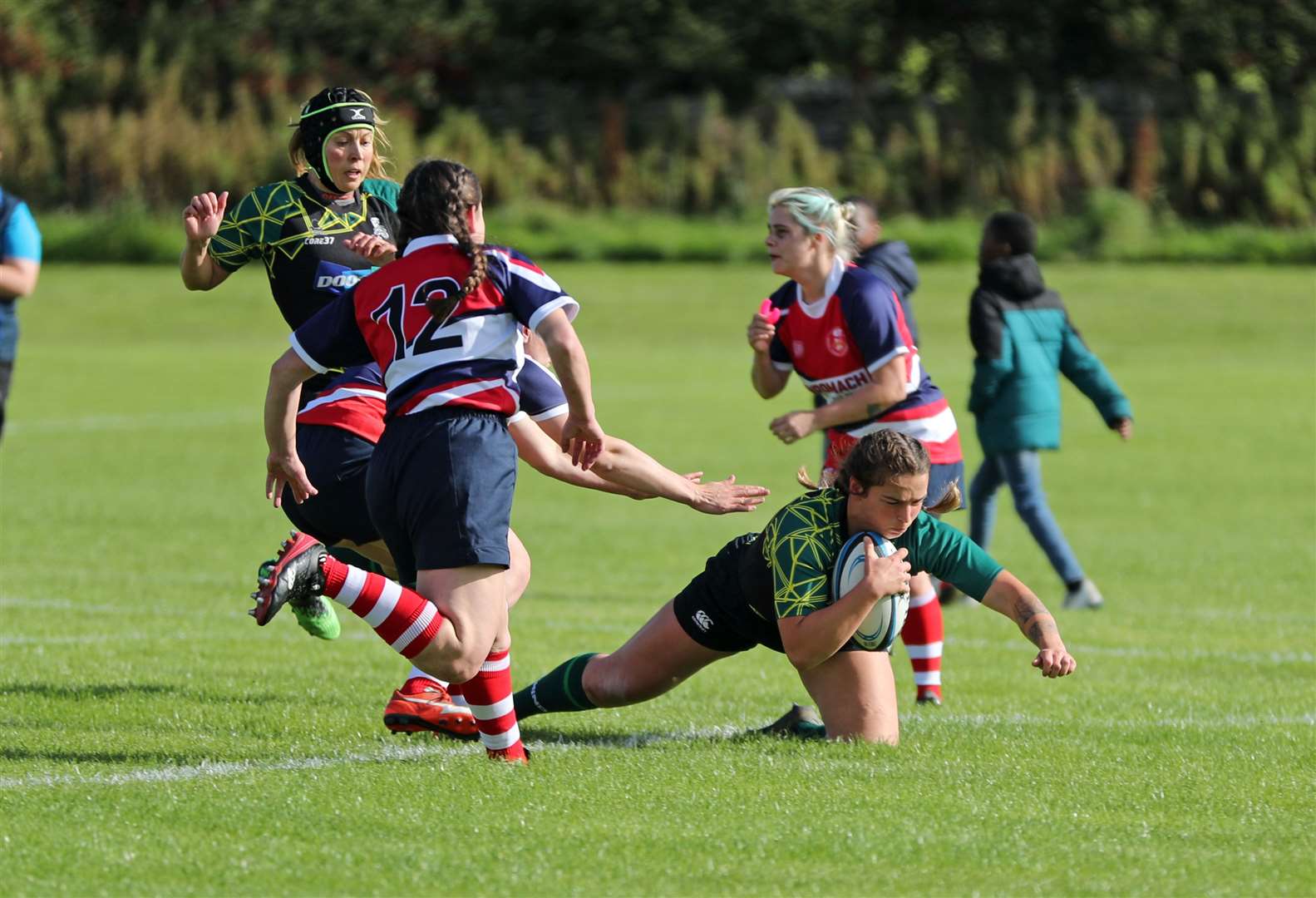 Emmy Smith touches down for one of her five tries against Moray. Picture: James Gunn