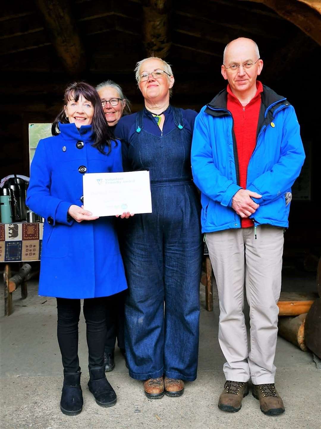 The Volunteer Friendly Award being presented to Dunnet Forestry Trust (DFT) director, Stephen Frame from Catherine Patterson of Caithness Voluntary Group. Also present were DFT's treasurer Shona Scatchard (at rear) and its development officer Garance Warburton.