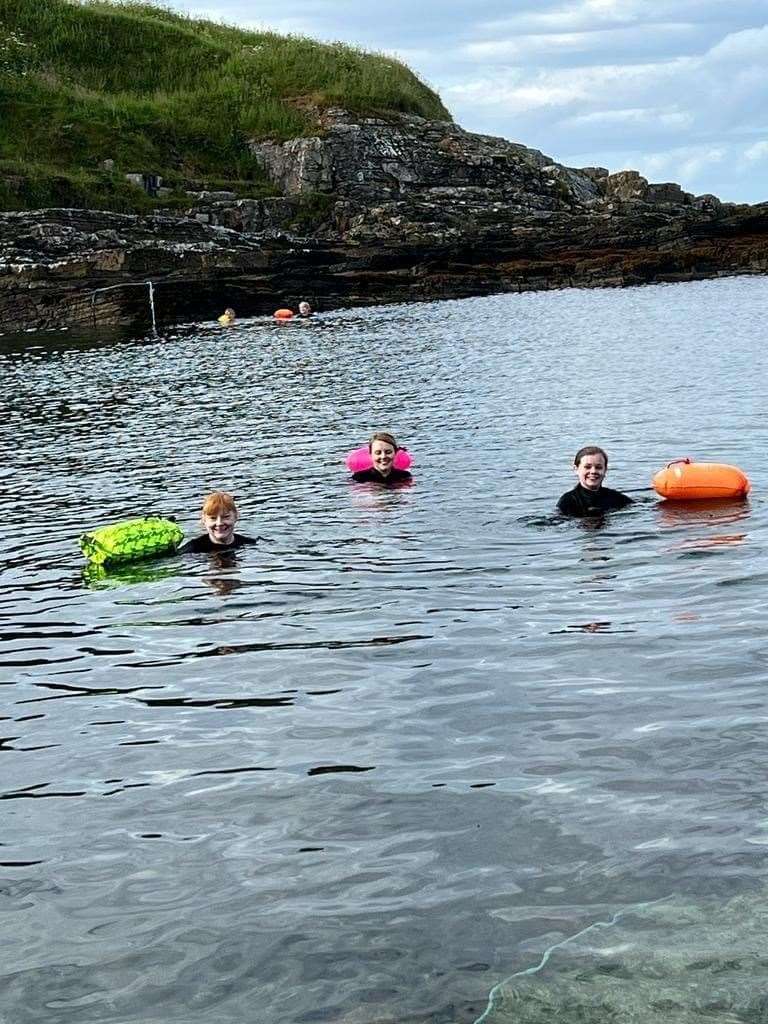 Caitlyn Irwin has raised hundreds of pounds for Caithness Cats Protection through her North Sea swimming challenge.