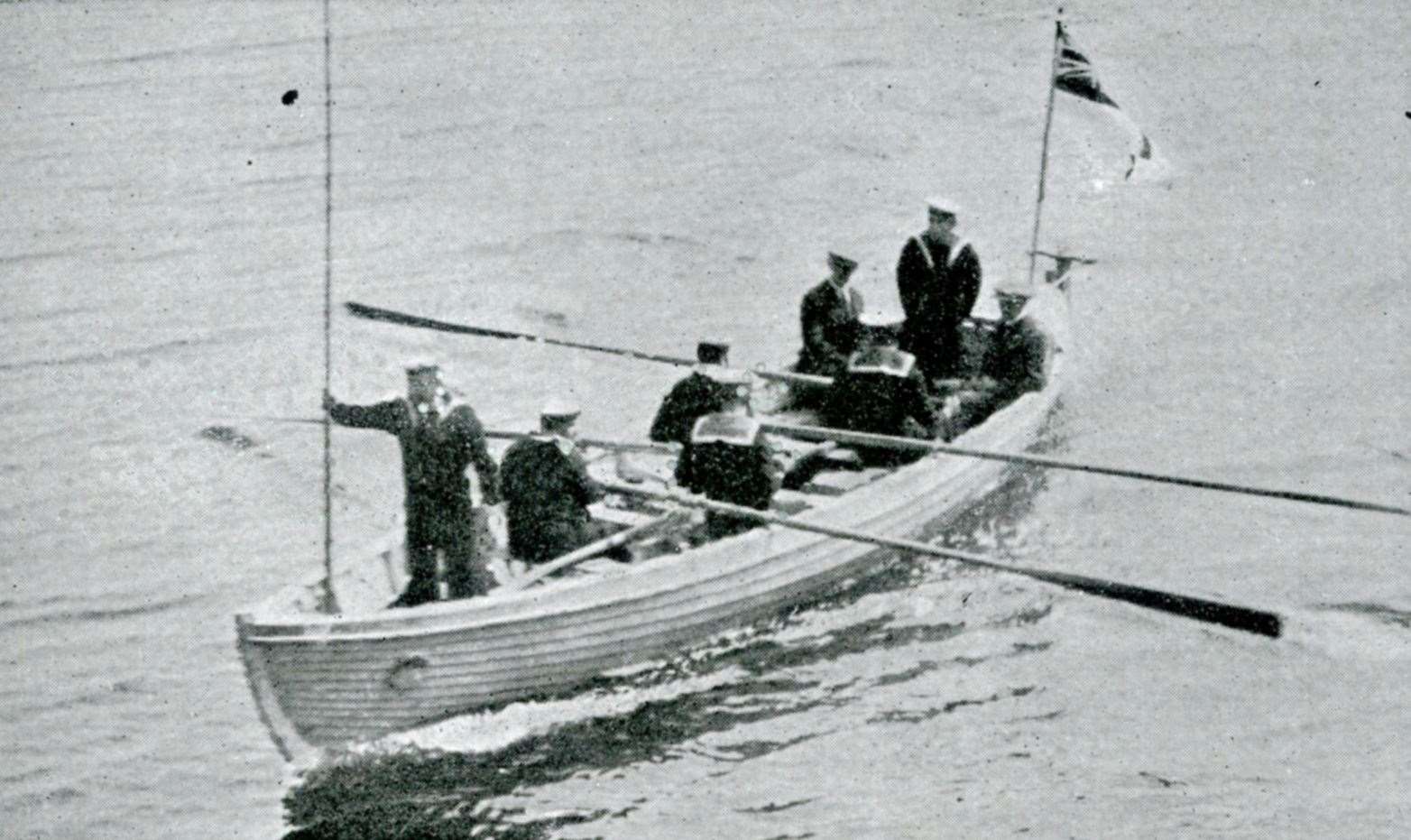 Hawker and Grieve being rowed ashore by bluejackets after arriving at Scrabster.