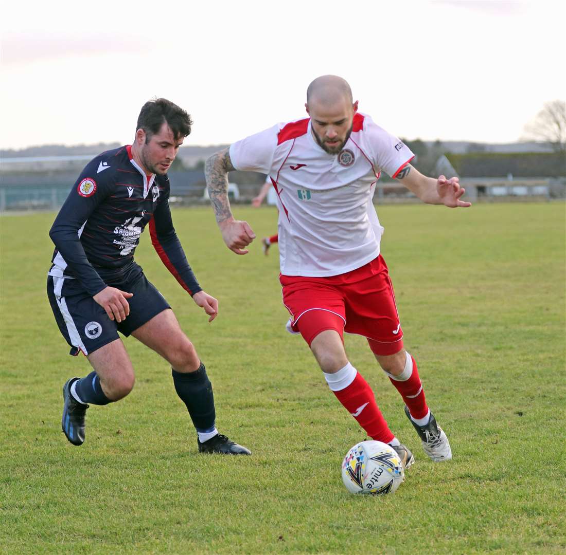 Sean Munro takes on an Inverness Athletic defender during Halkirk United's 2-0 win. Picture: James Gunn