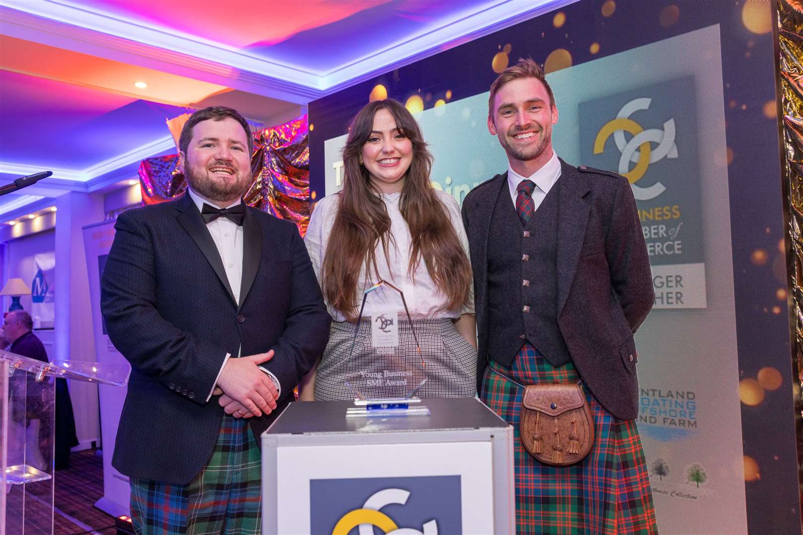 North Point Distillery co-Founder Struan Mackie and distillery manager Heather Ricker collect the young business award in the SME category from Isaac Connell (right), of award sponsor Pentland Floating Offshore Windfarm.