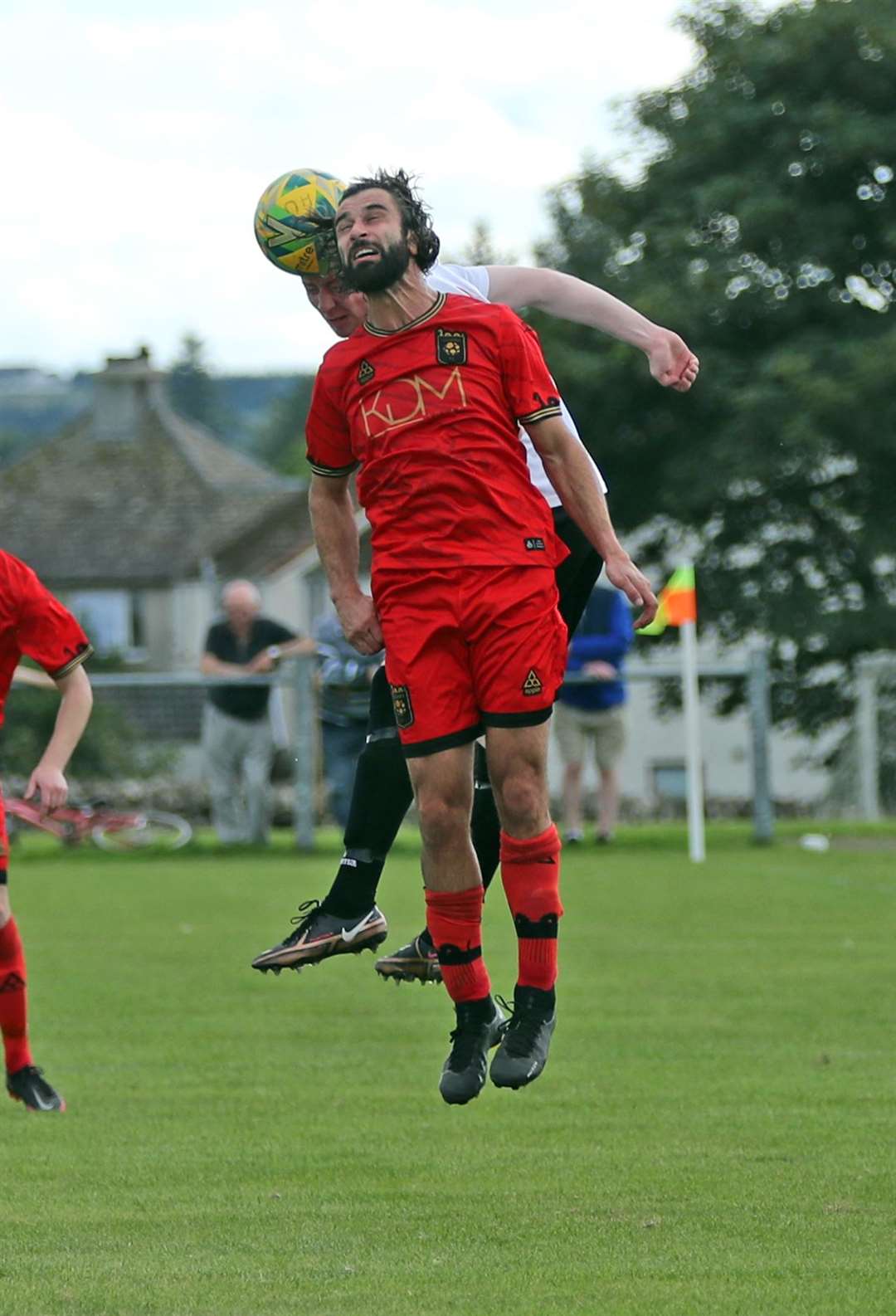 Phil Macdonald of Loch Ness in an aerial duel with Innes Mackintosh of Halkirk United. Picture: James Gunn