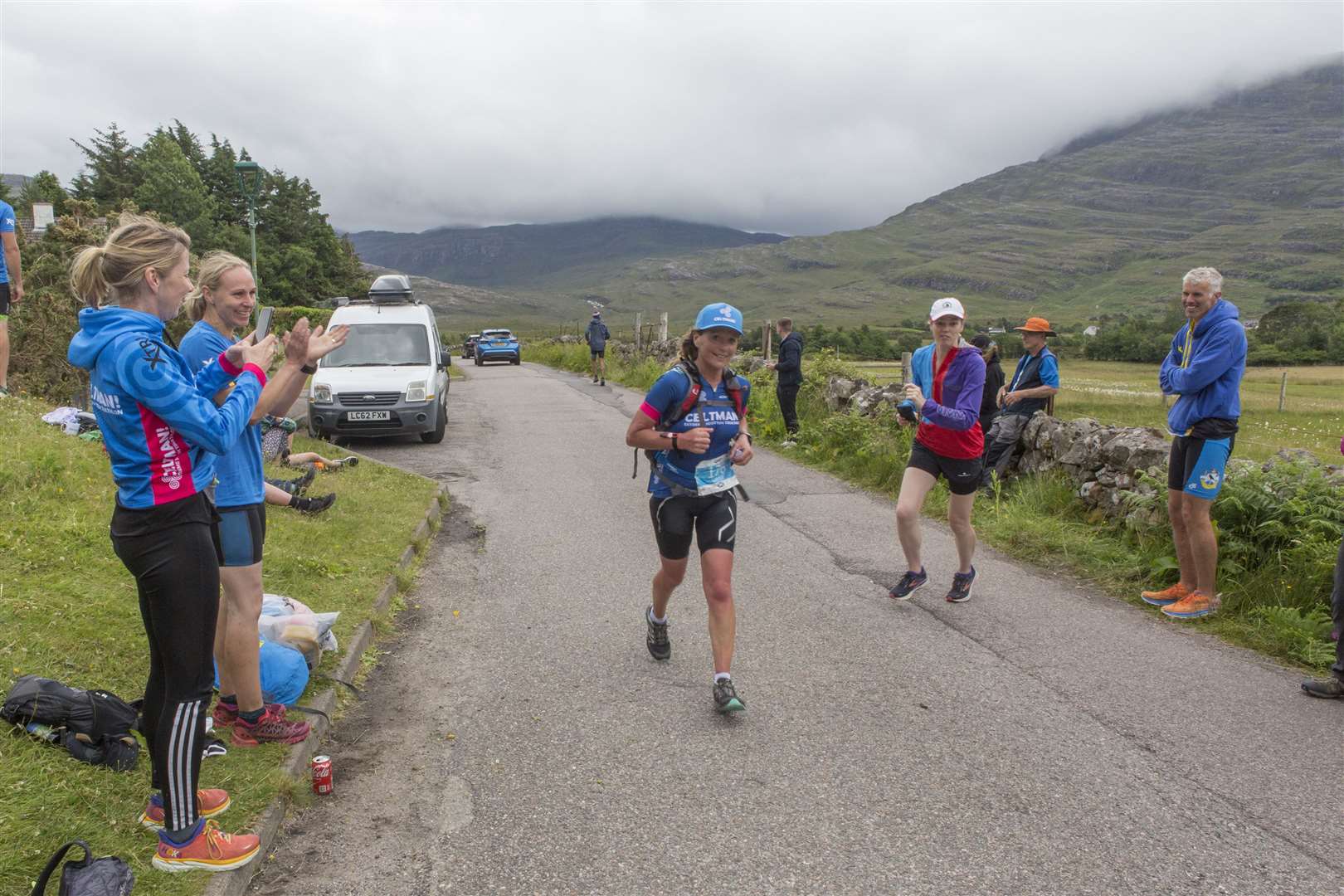 The Caithness contingent welcome Lorna Stanger as she nears the finish line in Torridon. Picture: Robert MacDonald/Northern Studios