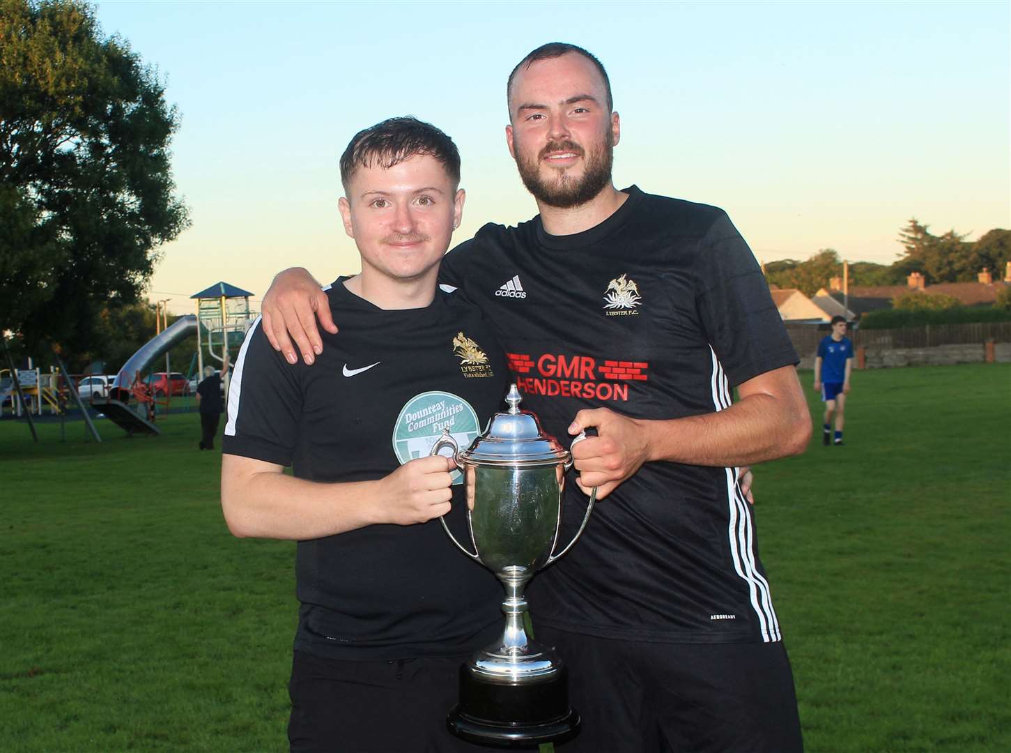 Lybster manager Cameron Mackenzie (left) and captain Gary Swanson with the Caithness AFA Division Two trophy in 2023. Mackenzie says Lybster are aiming to establish themselves in the top division this season. Picture: Alan Hendry