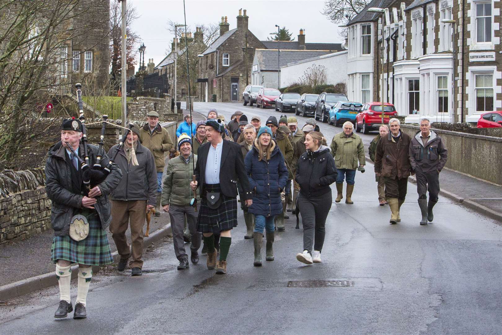 Piper Alasdair Miller leads the procession of anglers from the centre of Halkirk down to the River Thurso for the opening of the 2024 salmon season. Picture: Robert MacDonald / Northern Studios