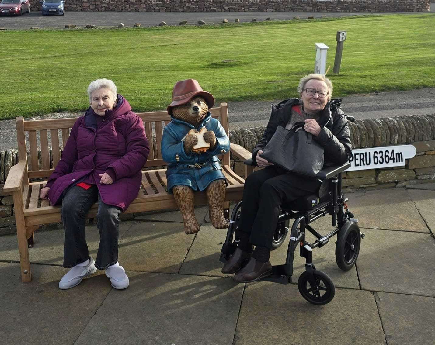 Marion Owen and Reena Warren visit with Paddington, much to their delight.