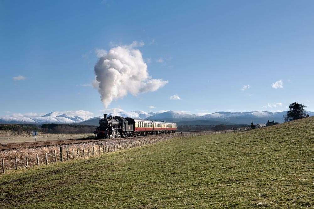 Let the train take the strain.... one of the Strathspey steam railway services on its way from Aviemore to Broomhill by Dulnain Bridge with the snowcapped Cairngorms in the background.