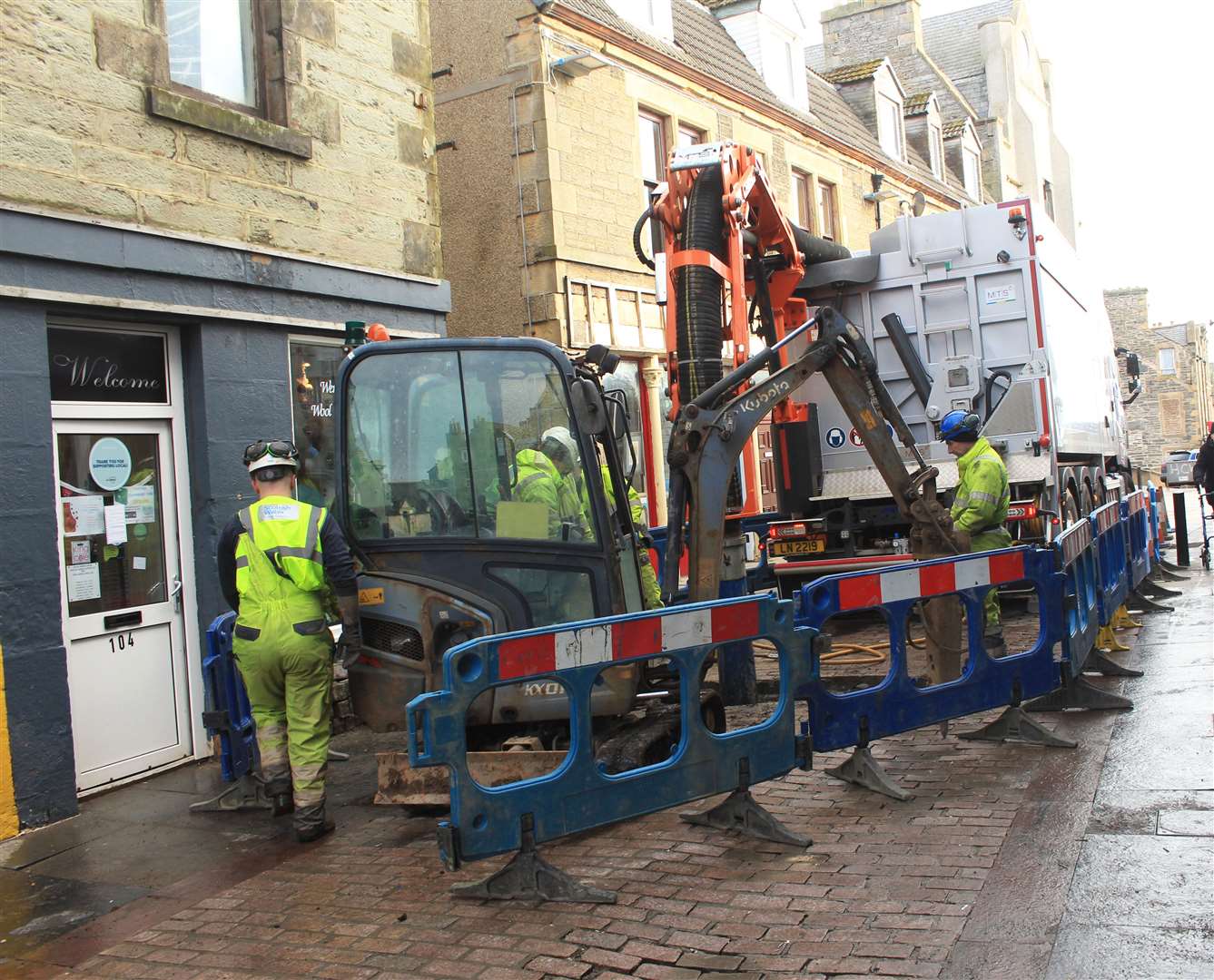 Workers trying to repair the burst water pipe in High Street, Wick, this morning.