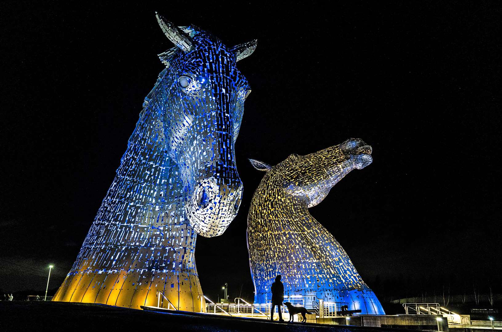 The Kelpies at Falkirk were illuminated in the colours of the Ukraine flag following the Russian invasion in February (Jane Barlow/PA)