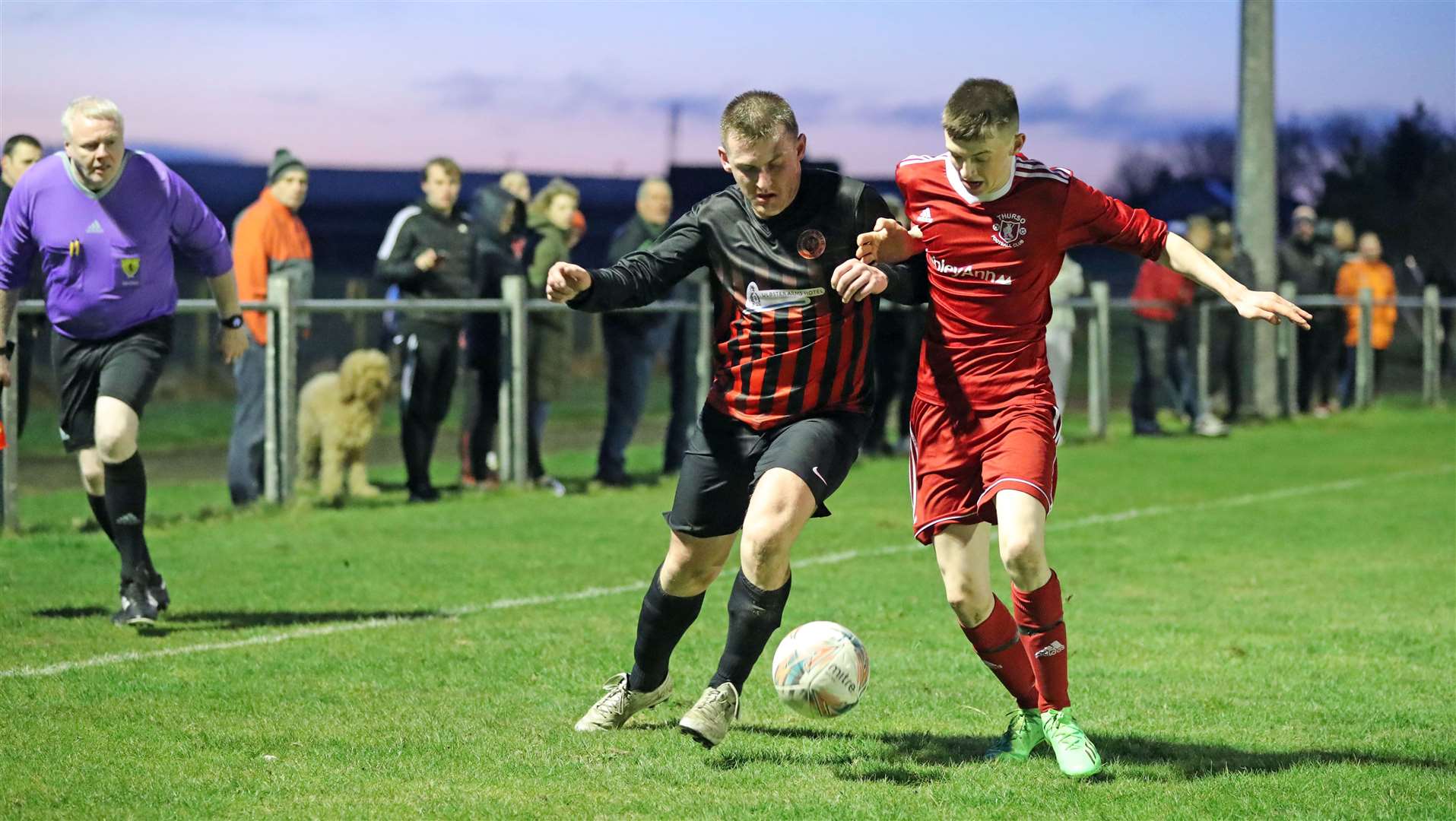 Halkirk United's Andy Mackay tries to get round Dylan Alexander of Thurso during the North Caledonian League derby at Morrison Park. Picture: James Gunn