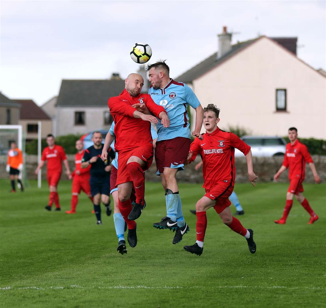 Pentland United's Luke Manson (right) wins this aerial duel with Sandy Sutherland. However, the Wick Groats man would be smiling at the end as his side defeated Pentland 5-2 to win the Colin Macleod Memorial Cup. Picture: James Gunn